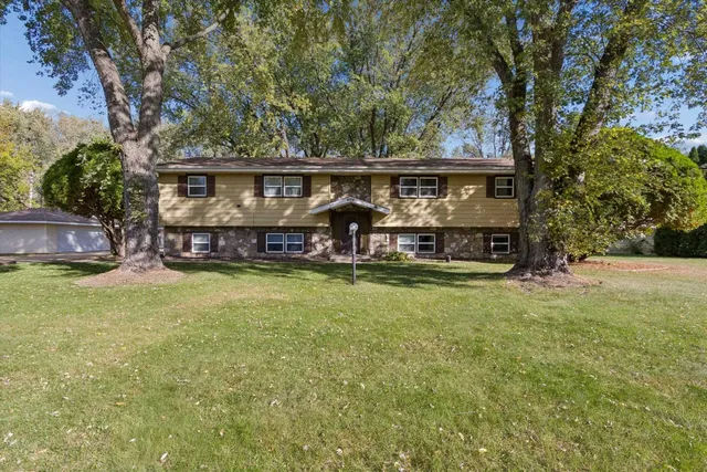 a view of house with outdoor space and swimming pool
