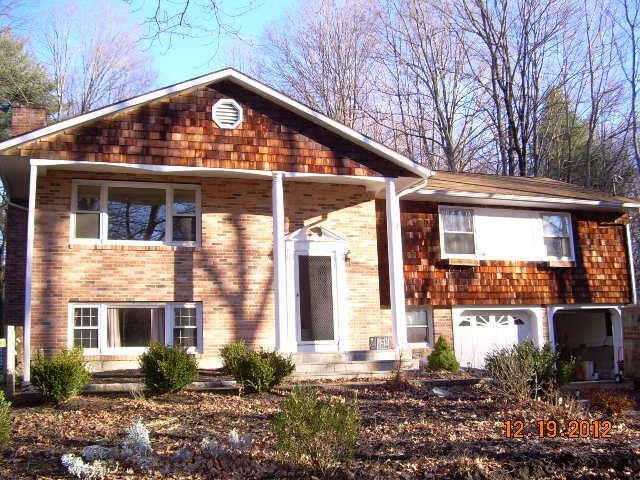 28 Starrs Plain Road Danbury, CT 06810 - Photo 1 of 1 a front view of a house with garden