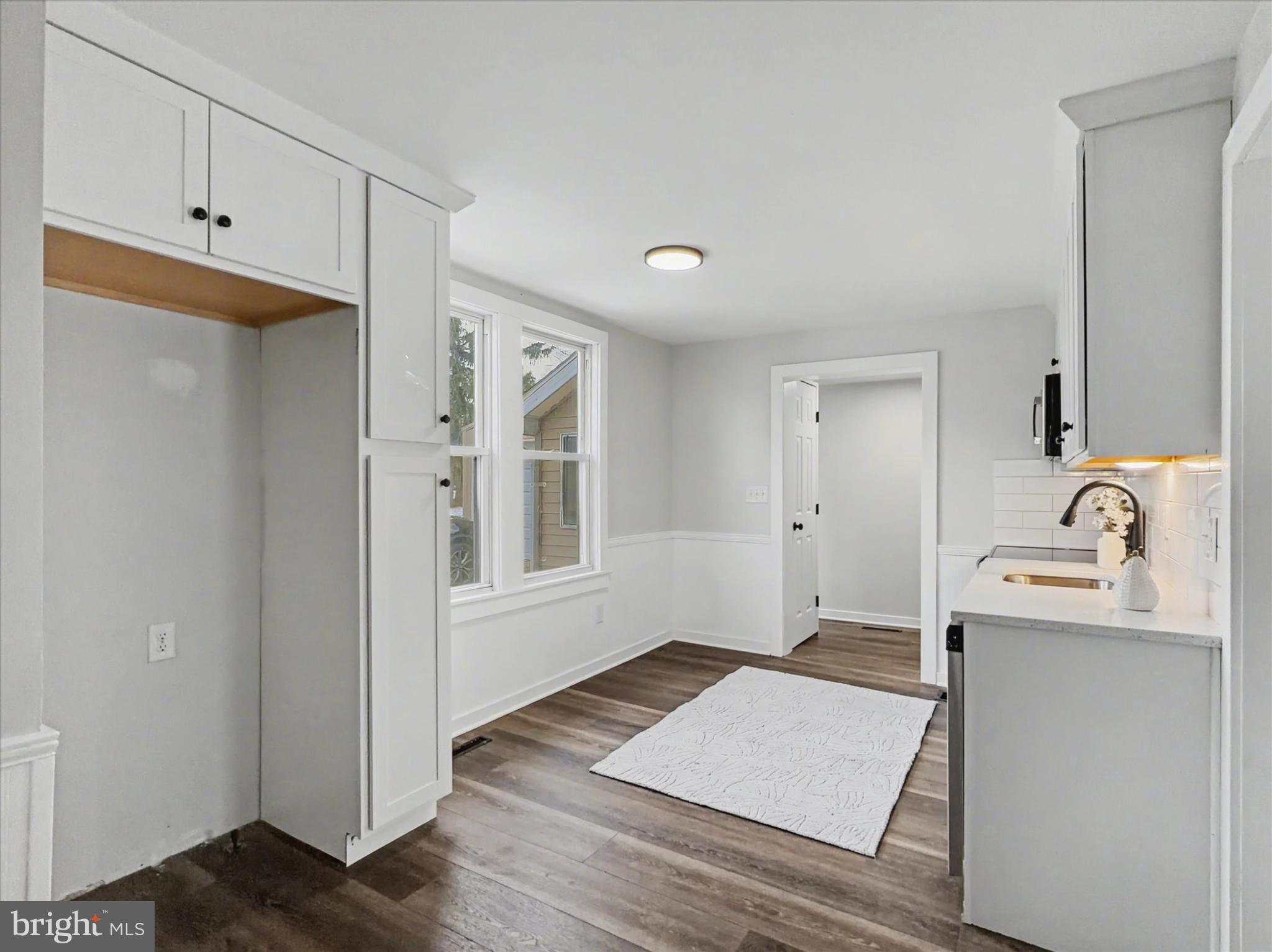 744 Forge Road Carlisle, PA 17015 - Photo 14 of 22 a view of a kitchen with wooden floor and a sink