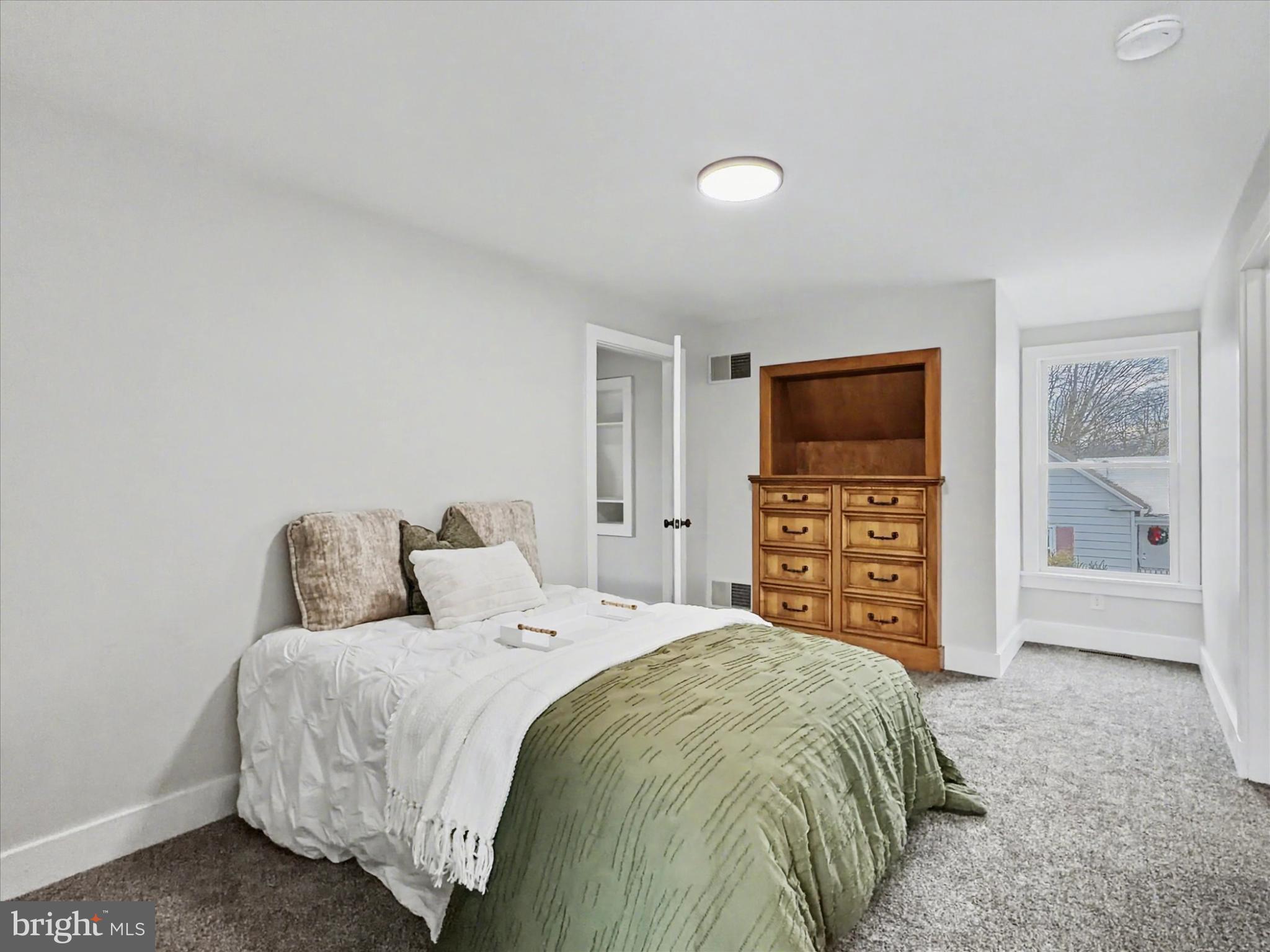 744 Forge Road Carlisle, PA 17015 - Photo 19 of 22 a bedroom with a bed and a television