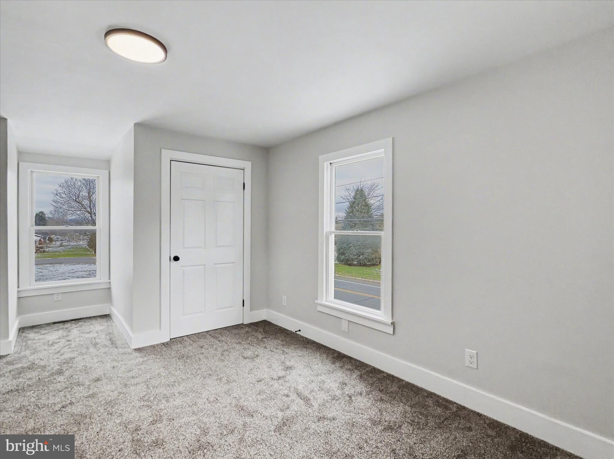 744 Forge Road Carlisle, PA 17015 - Photo 2 of 22 an empty room with windows