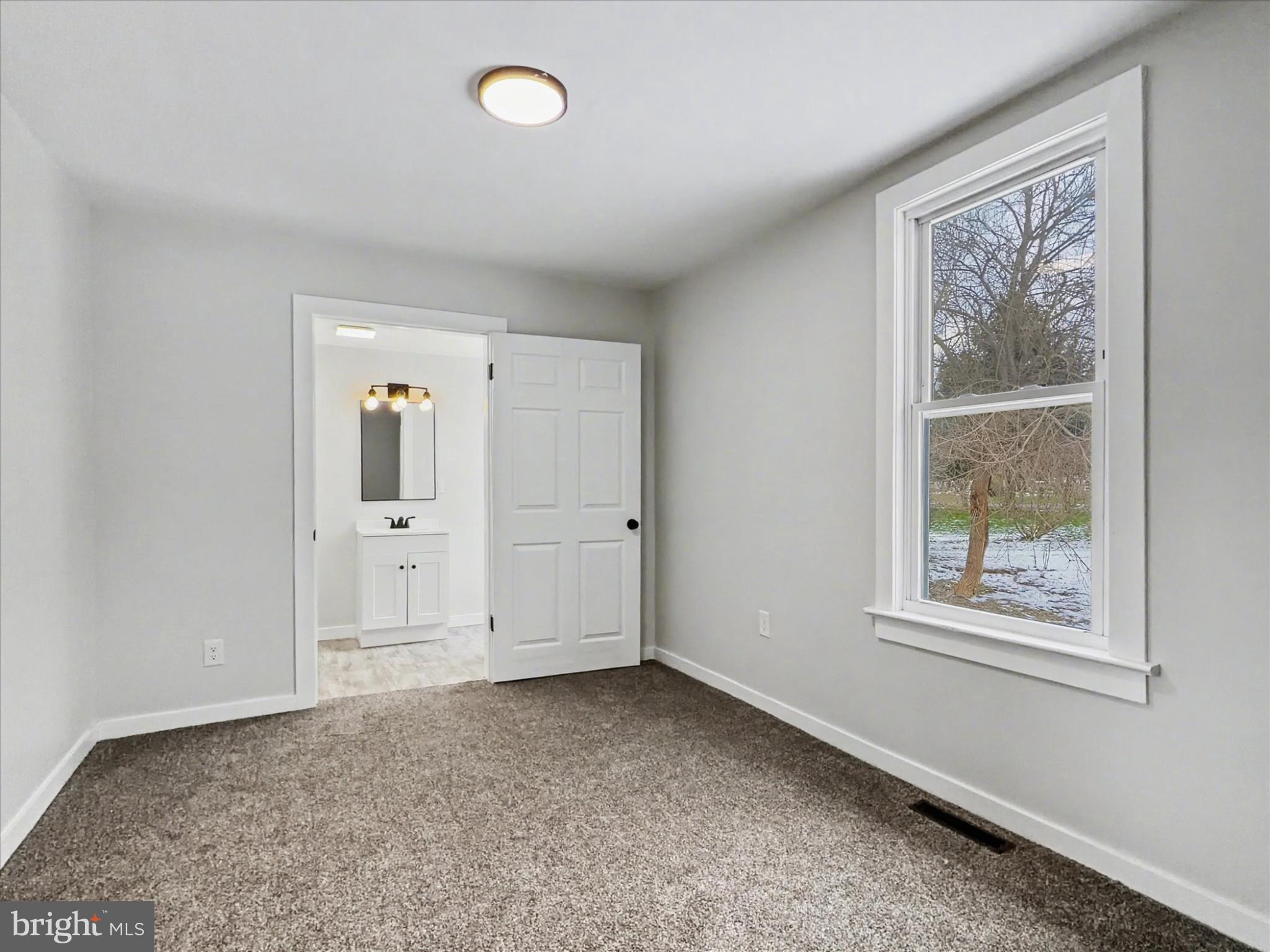 744 Forge Road Carlisle, PA 17015 - Photo 9 of 22 an empty room with windows