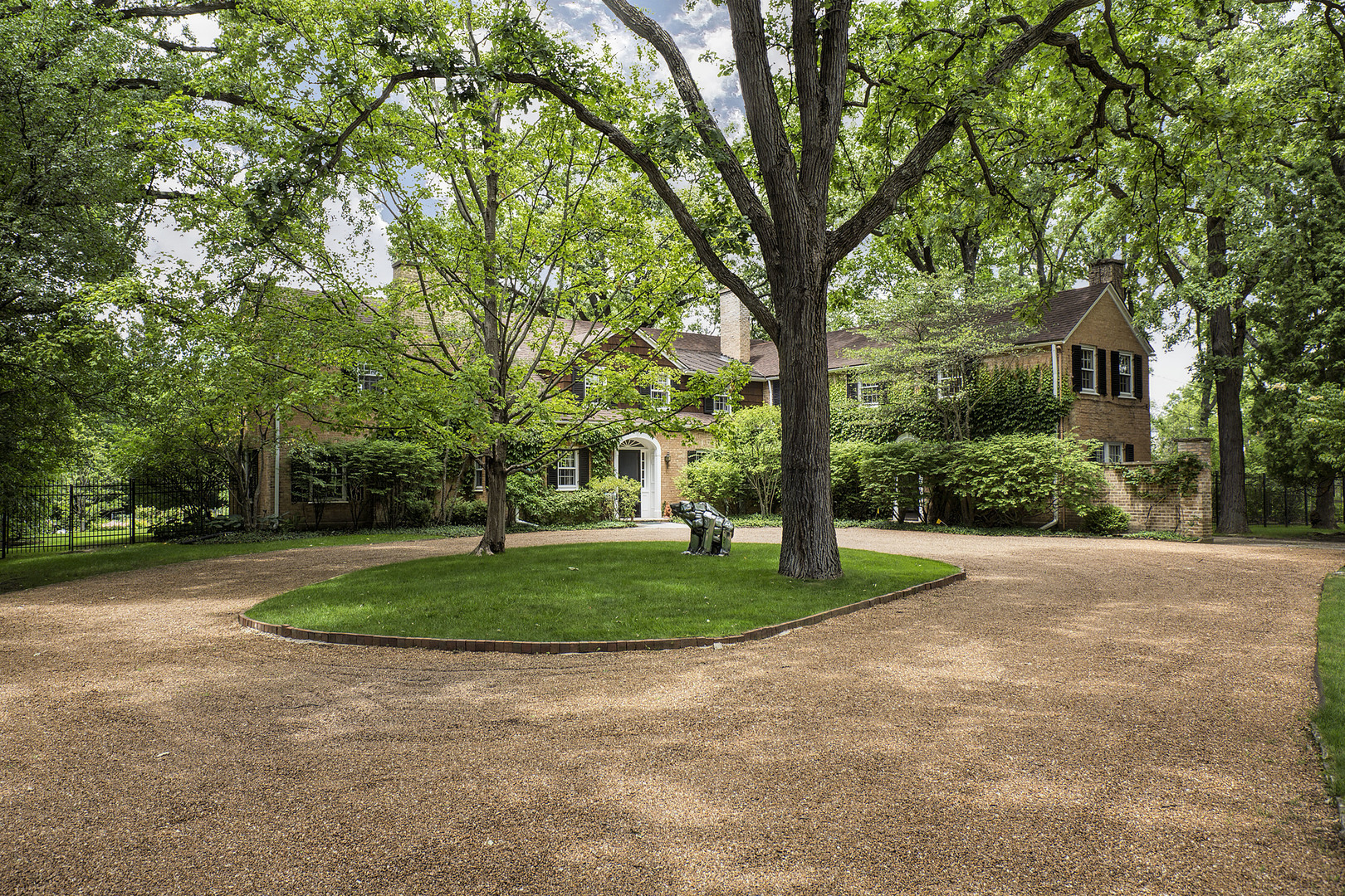 a view of a backyard with large trees