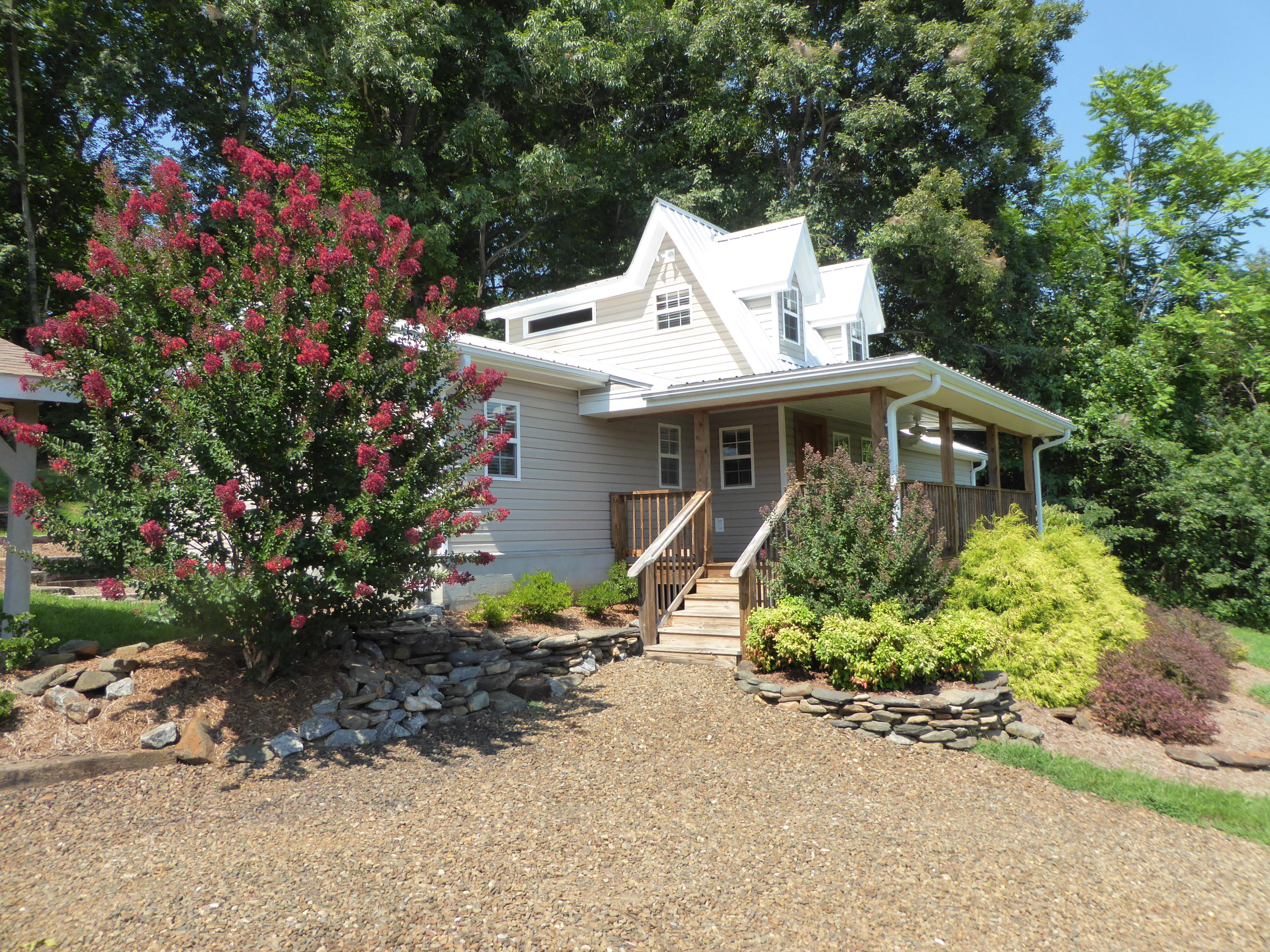 500 Hurds Branch Road Ferrum, VA 24088 - Photo 16 of 60 a view of a house with a yard and garden