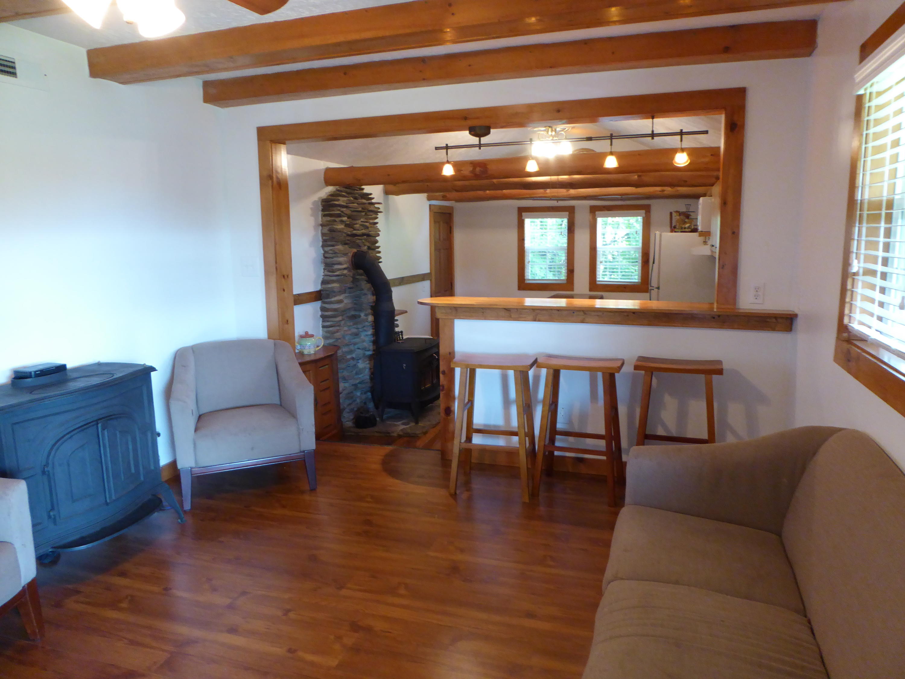 500 Hurds Branch Road Ferrum, VA 24088 - Photo 20 of 60 a living room with furniture and a chandelier