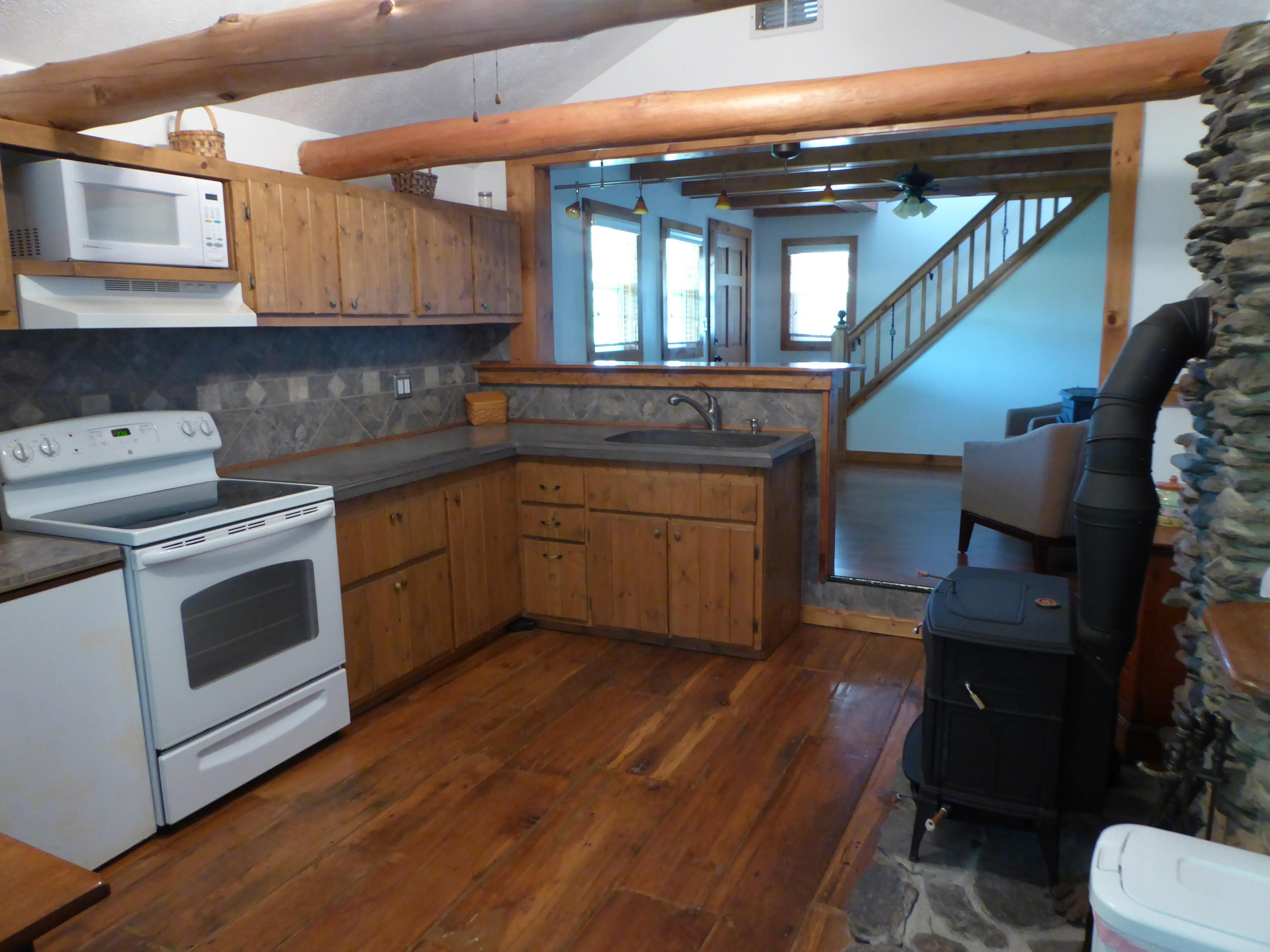 500 Hurds Branch Road Ferrum, VA 24088 - Photo 3 of 60 a kitchen with a sink cabinets and wooden floor