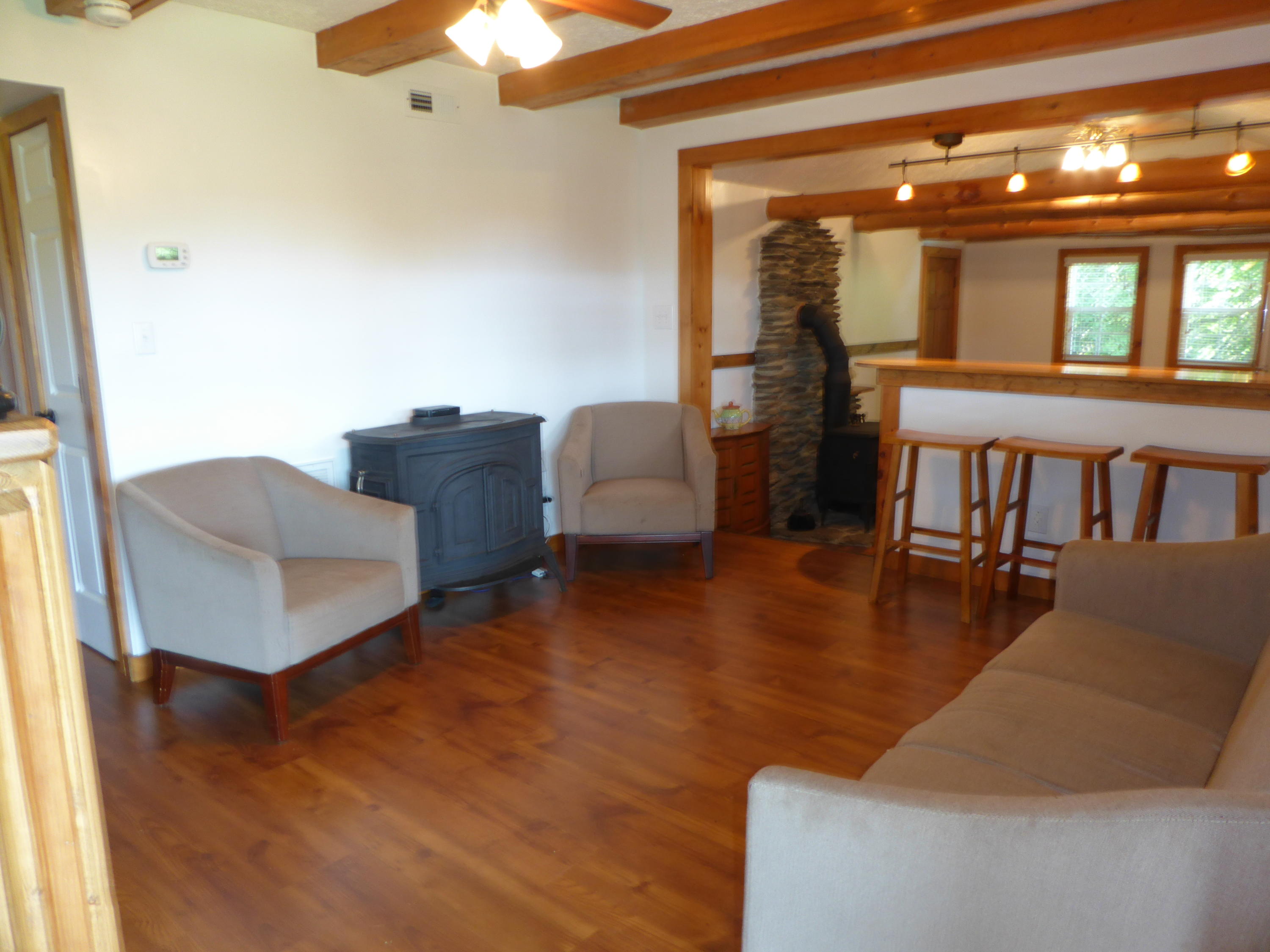 500 Hurds Branch Road Ferrum, VA 24088 - Photo 21 of 60 a living room with furniture and a chandelier