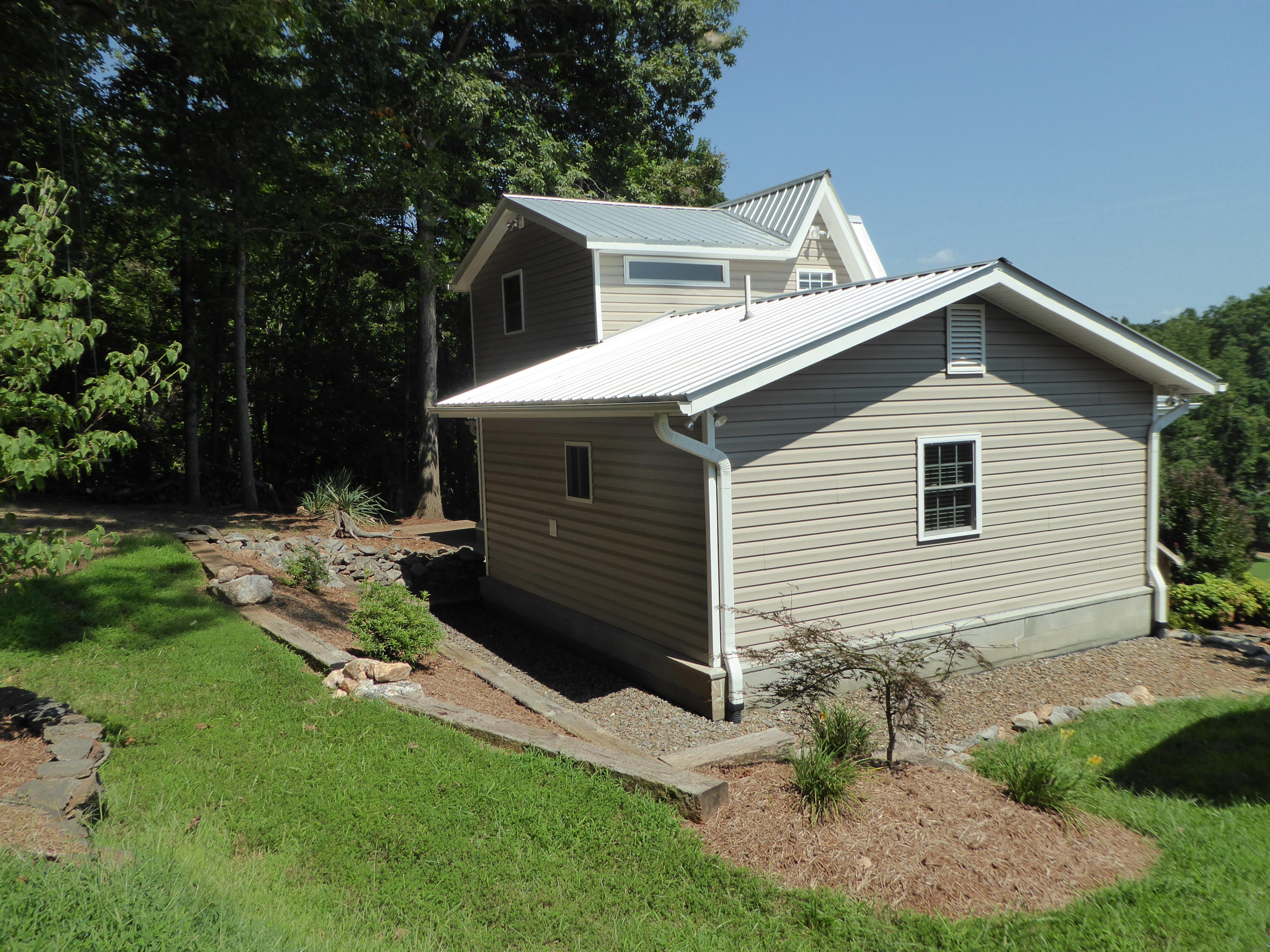 500 Hurds Branch Road Ferrum, VA 24088 - Photo 36 of 60 a front view of a house with garden