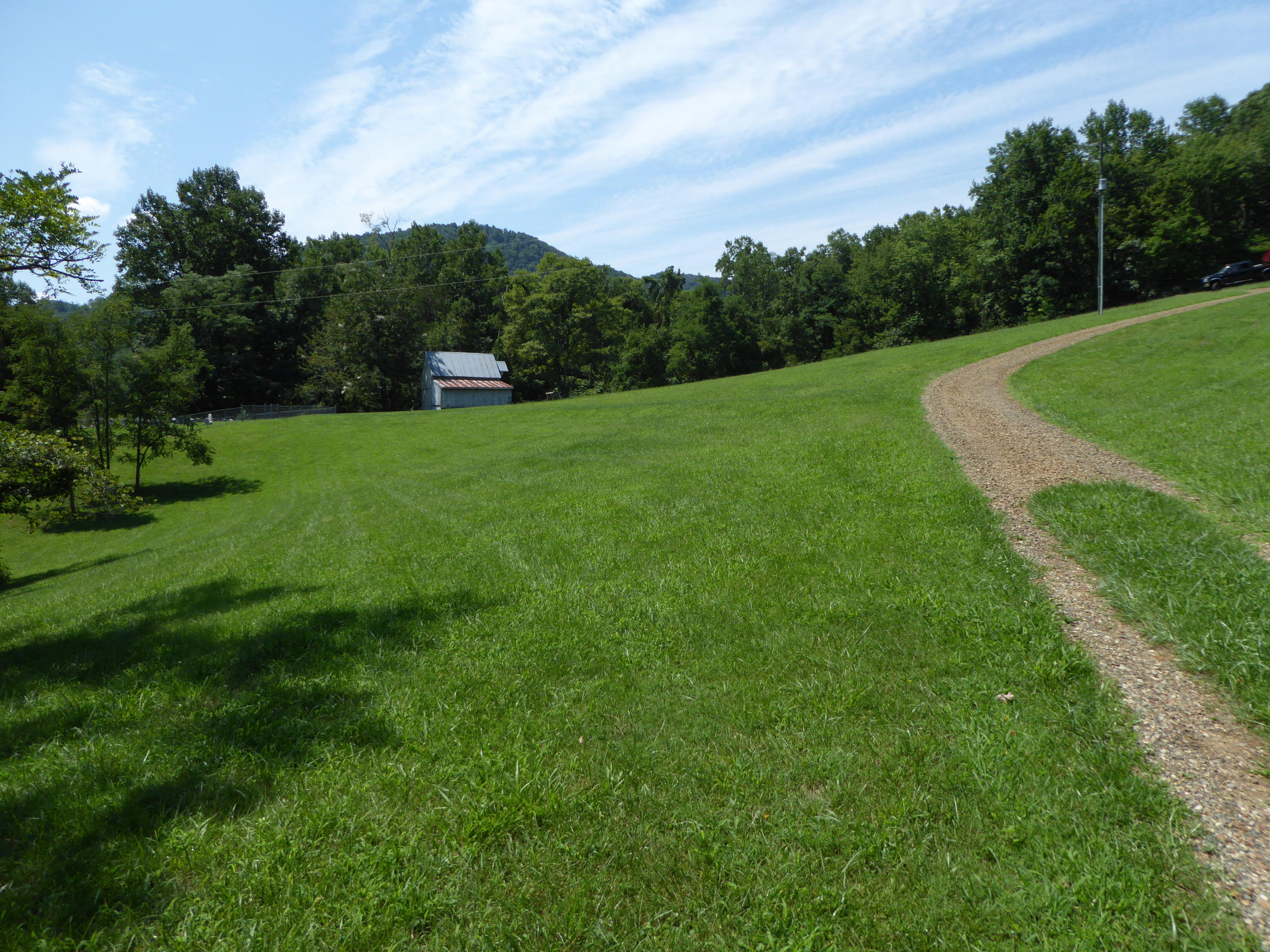 500 Hurds Branch Road Ferrum, VA 24088 - Photo 54 of 60 a view of a grassy field with trees in the background