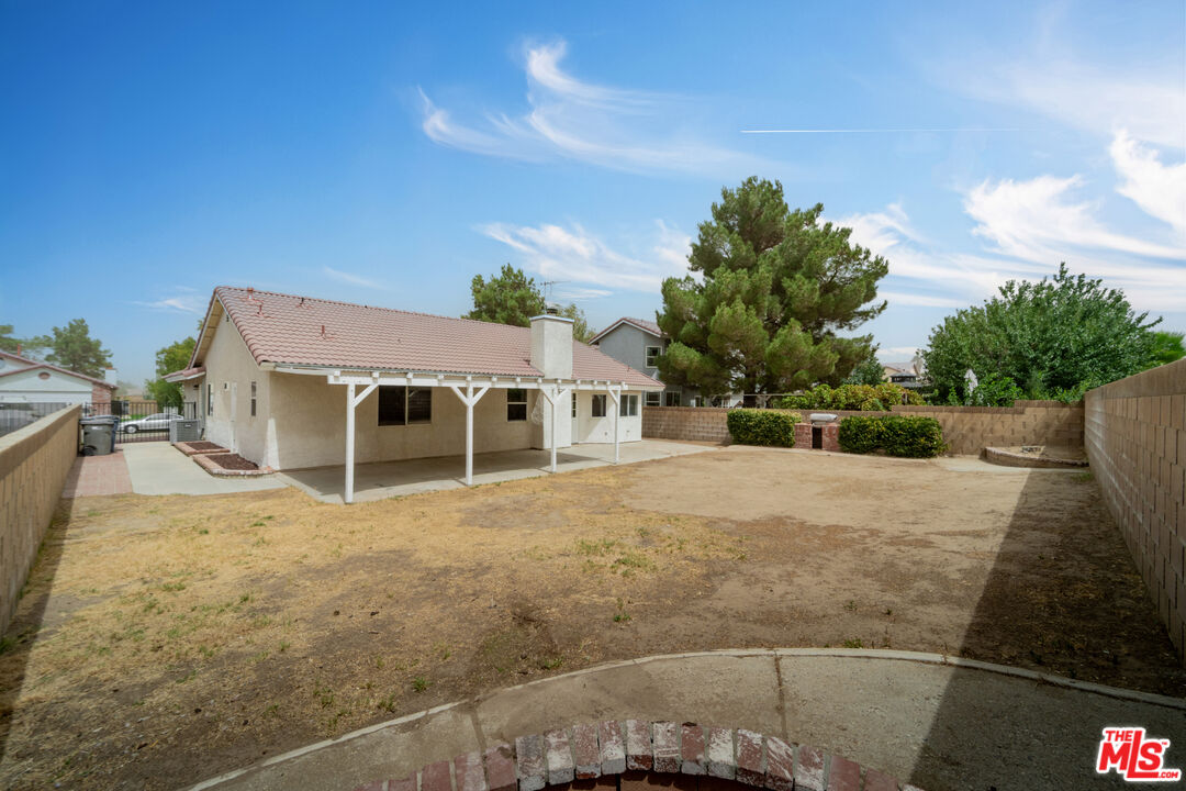 716 East E Avenue Lancaster, CA 93535 - Photo 16 of 17 a view of a house with a backyard
