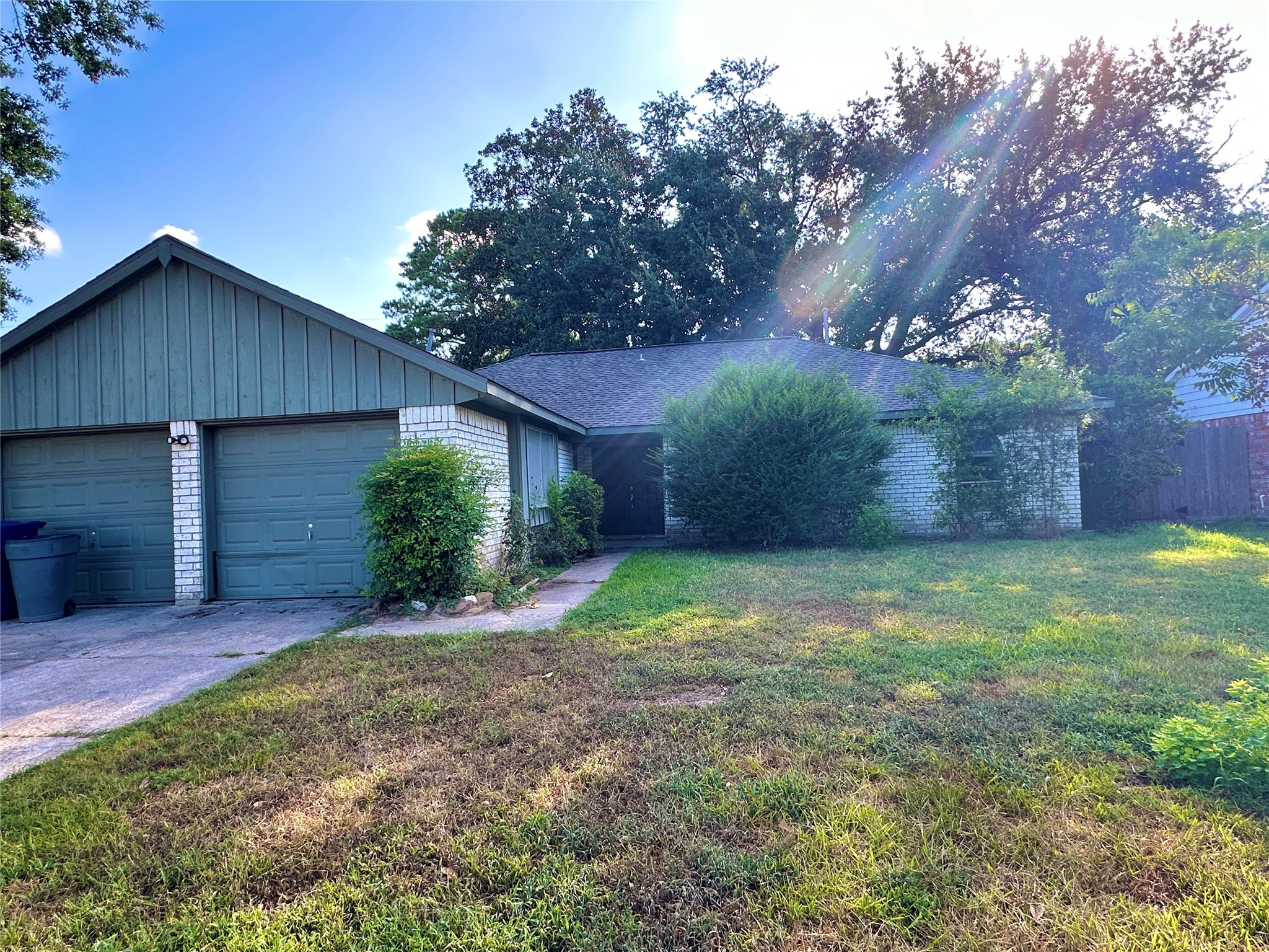 29410 Binefield Street Spring, TX 77386 - Photo 1 of 13 a view of a backyard with potted plants and large trees