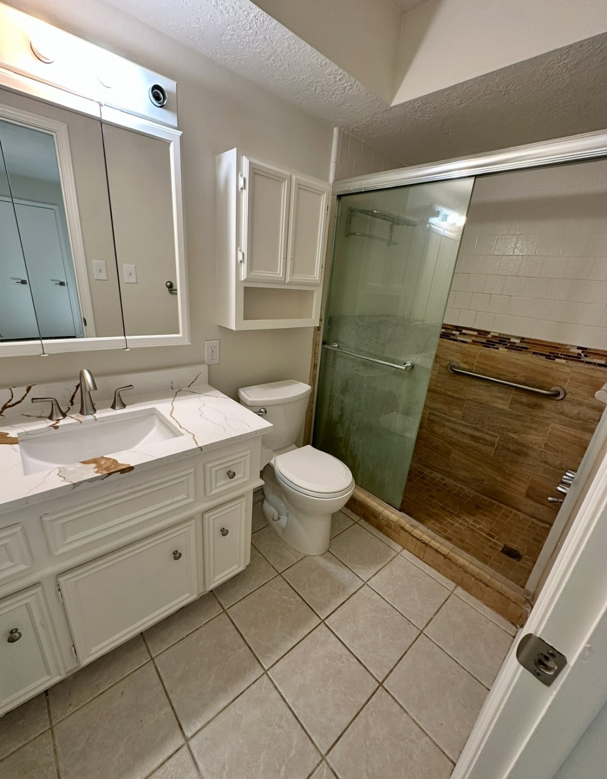 29410 Binefield Street Spring, TX 77386 - Photo 11 of 13 a bathroom with a sink a toilet a mirror and shower