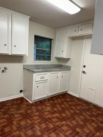 a kitchen with a stove and a refrigerator