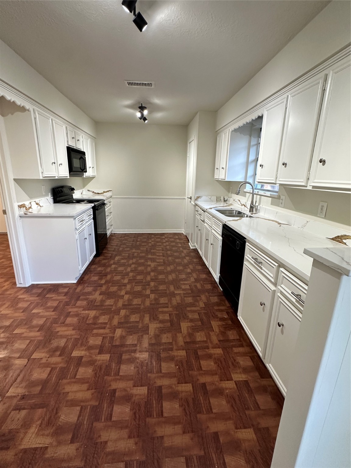 29410 Binefield Street Spring, TX 77386 - Photo 5 of 13 a large kitchen with kitchen island granite countertop a sink counter top space appliances and cabinets