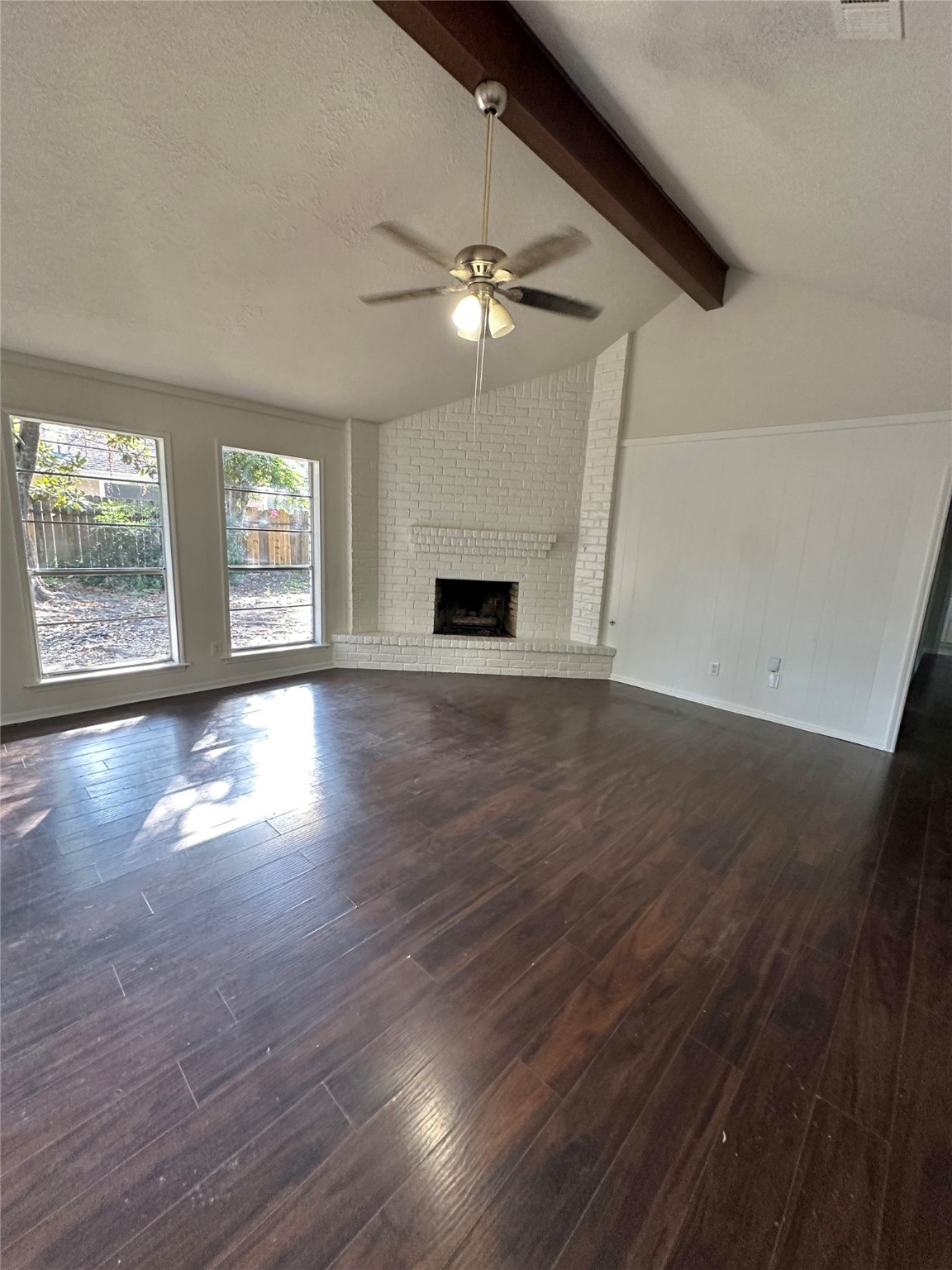 29410 Binefield Street Spring, TX 77386 - Photo 6 of 13 an empty room with wooden floor chandelier fan and windows