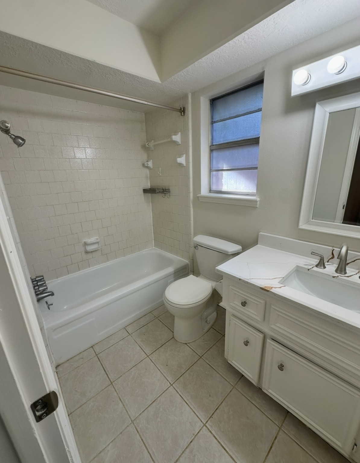 29410 Binefield Street Spring, TX 77386 - Photo 9 of 13 a bathroom with a granite countertop sink a toilet mirror and bathtub