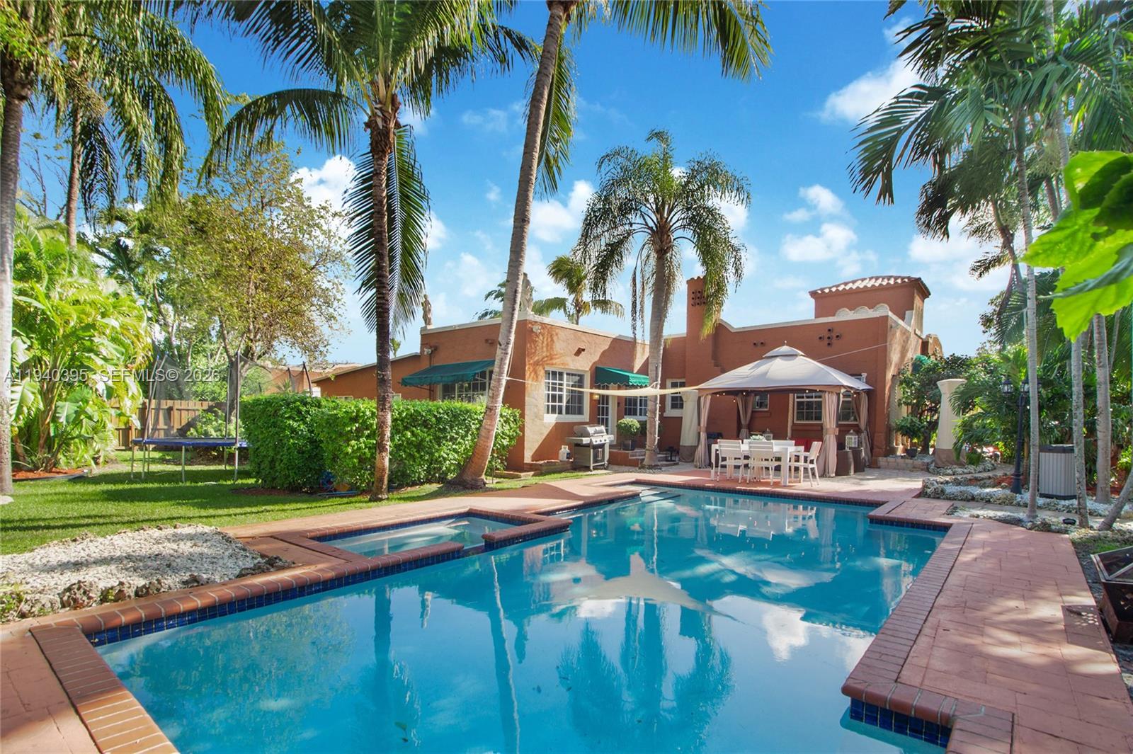 2985 Southwest 13th Street Miami, FL 33145 - Photo 12 of 27 a house with swimming pool in front of it