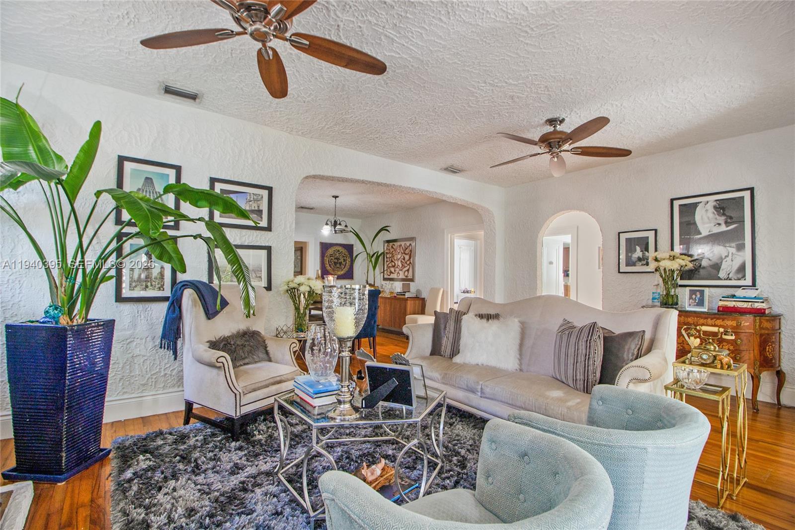 2985 Southwest 13th Street Miami, FL 33145 - Photo 20 of 27 a living room with furniture and a chandelier
