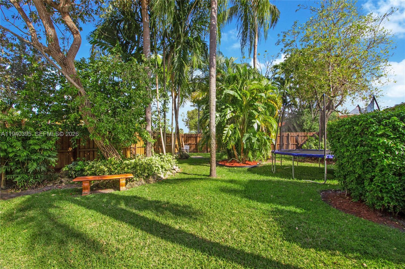 2985 Southwest 13th Street Miami, FL 33145 - Photo 2 of 27 a view of a park with large trees
