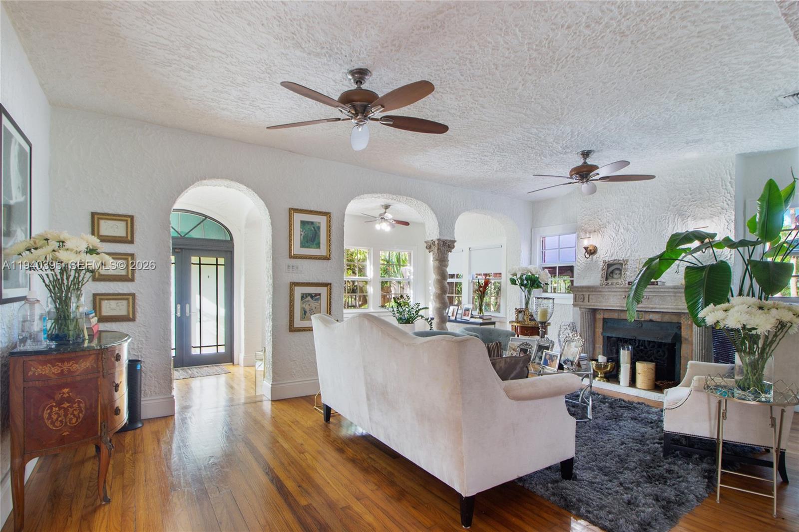2985 Southwest 13th Street Miami, FL 33145 - Photo 21 of 27 a living room with furniture fireplace and wooden floor