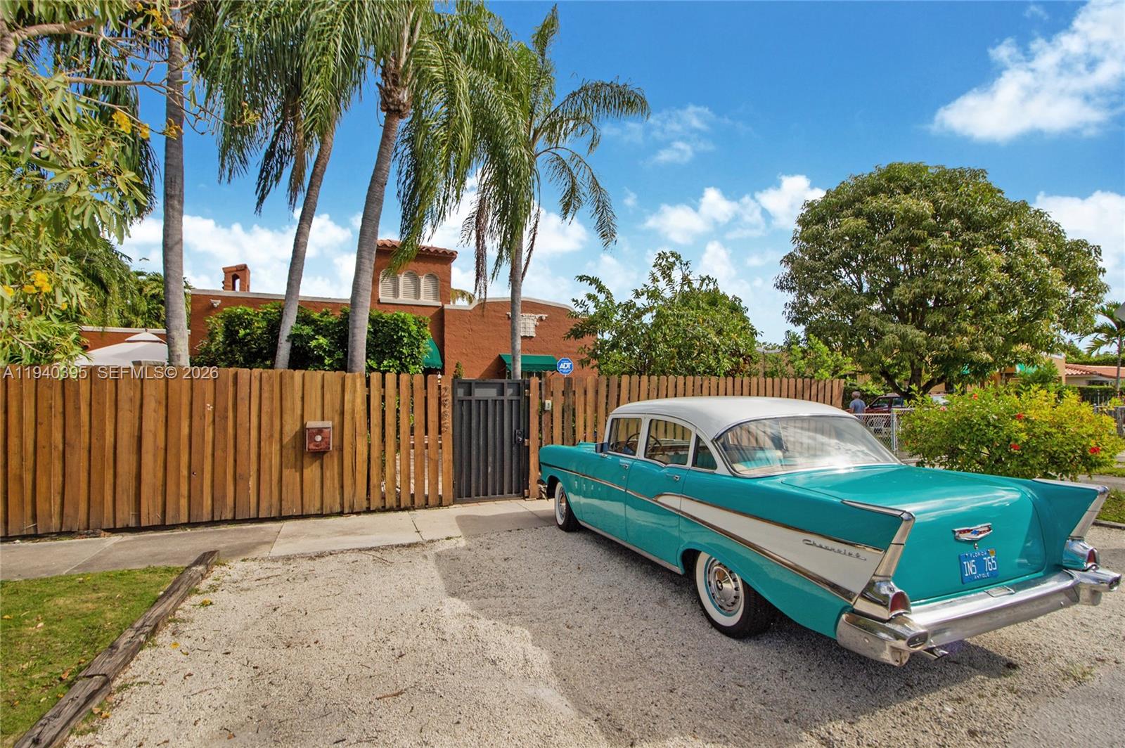 2985 Southwest 13th Street Miami, FL 33145 - Photo 3 of 27 a backyard of a house with barbeque oven and outdoor seating