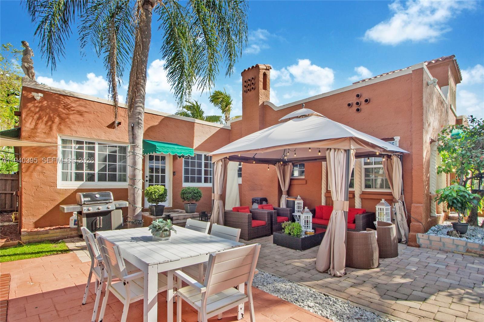 2985 Southwest 13th Street Miami, FL 33145 - Photo 9 of 27 a view of a patio with table and chairs and potted plants