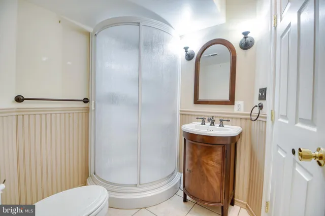 a bathroom with a sink a mirror and a toilet