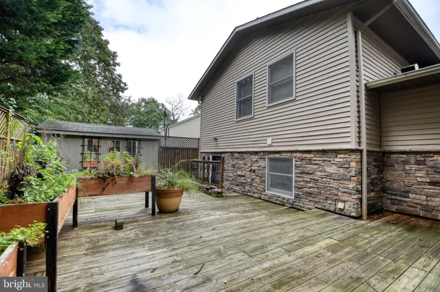 a view of a chair and tables back yard of the house