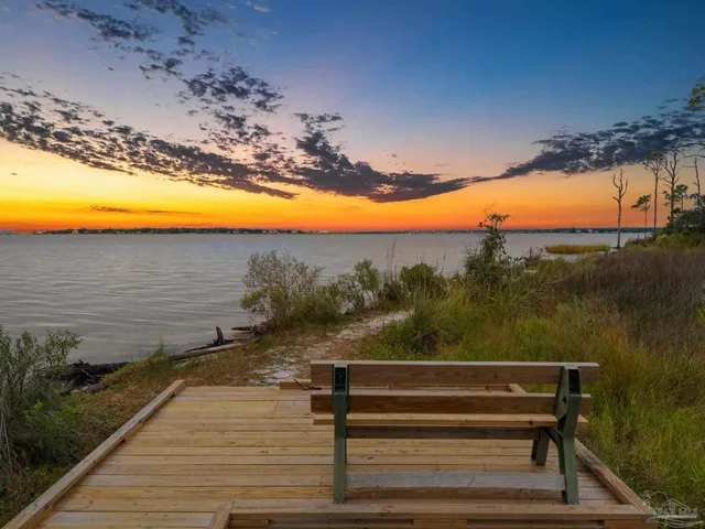 a view of a yard with an ocean view