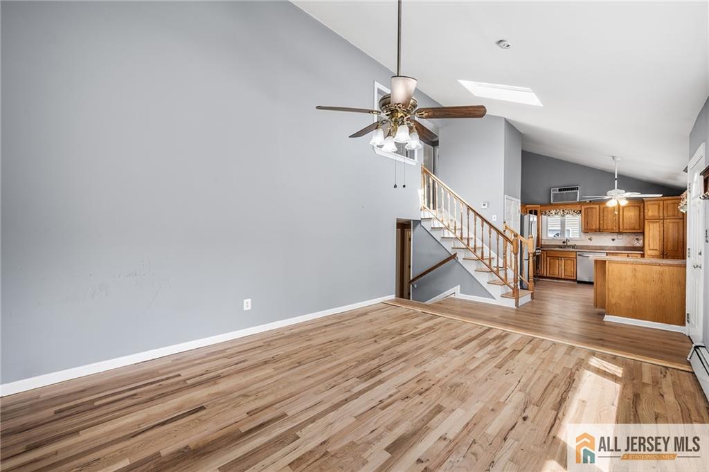 67 Drake Place Colonia, NJ 07067 - Photo 5 of 31 a view of a room with wooden floor and staircase