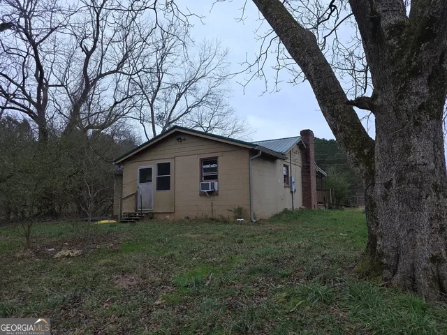 a house with trees in the background