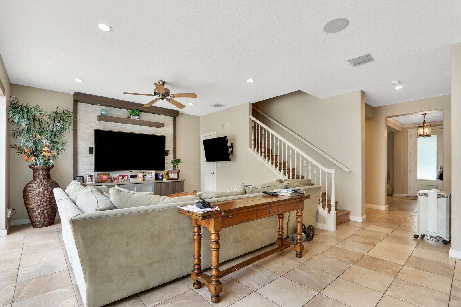 101 St Pierre Way Jupiter, FL 33458 - Photo 13 of 57 a living room with furniture and a flat screen tv