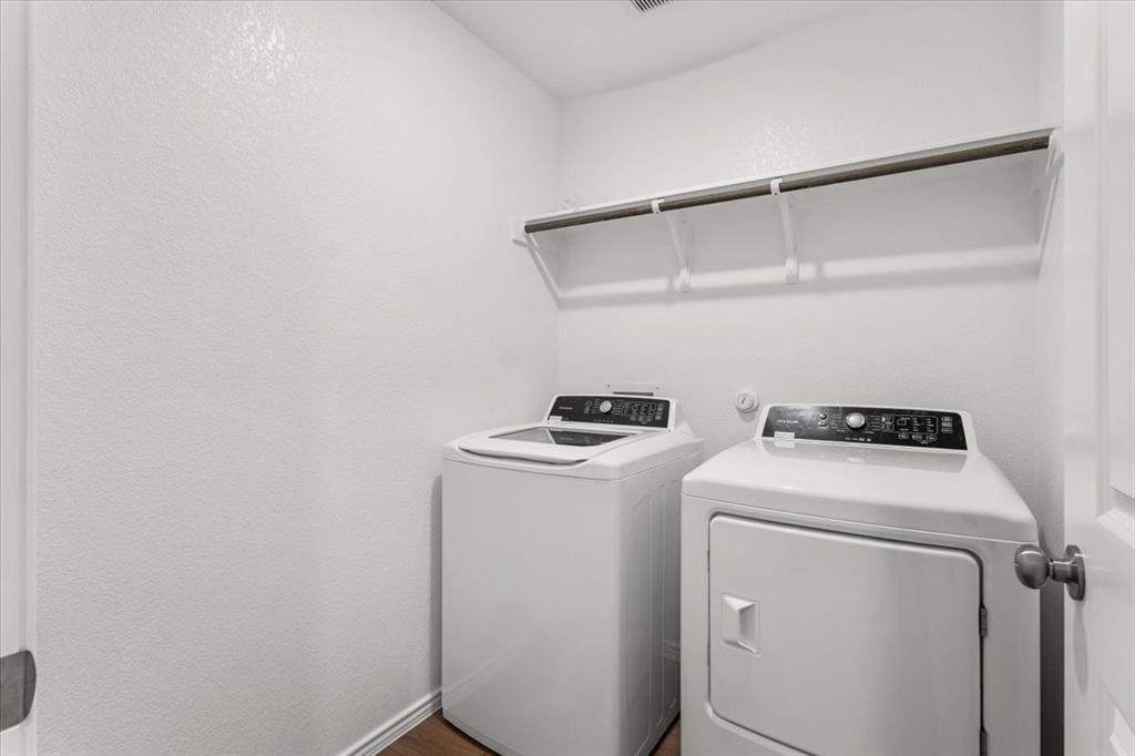 487 Alamito Avenue Kyle, TX 78640 - Photo 18 of 36 a utility room with dryer and washer