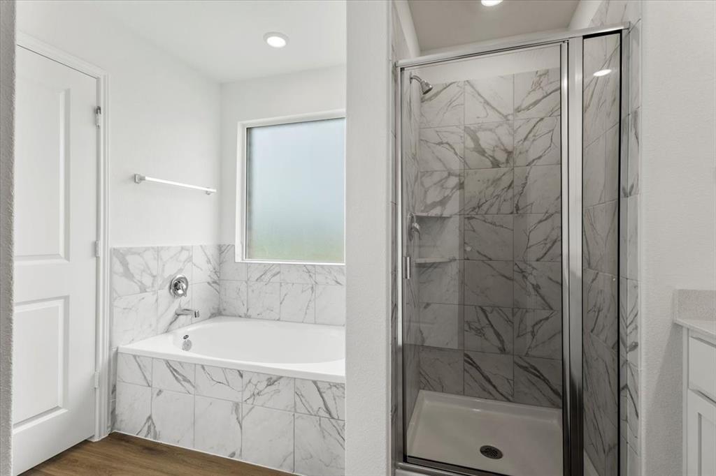 487 Alamito Avenue Kyle, TX 78640 - Photo 26 of 36 a bathroom with a bathtub and shower