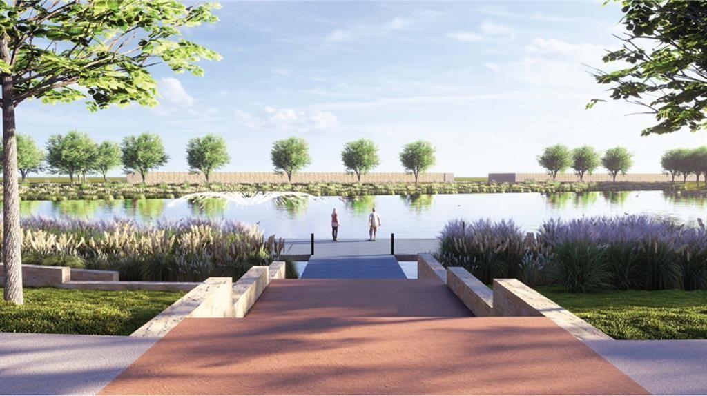 487 Alamito Avenue Kyle, TX 78640 - Photo 33 of 36 a view of a lake with houses in the back