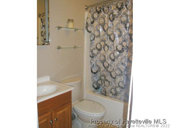 2376 Butler Island Road Roseboro, NC 28382 - Photo 15 of 20 a bathroom with a toilet and a shower