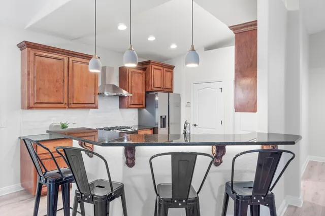 a stove top oven sitting inside of a kitchen