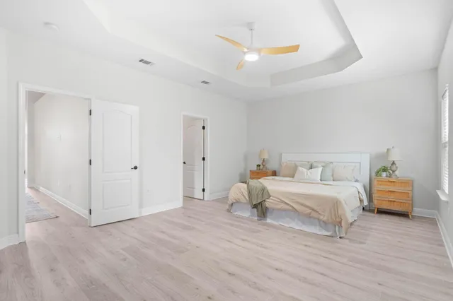 a bed room with a bed and a window