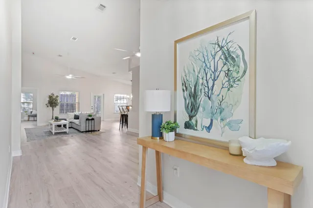 a living room with furniture and a table