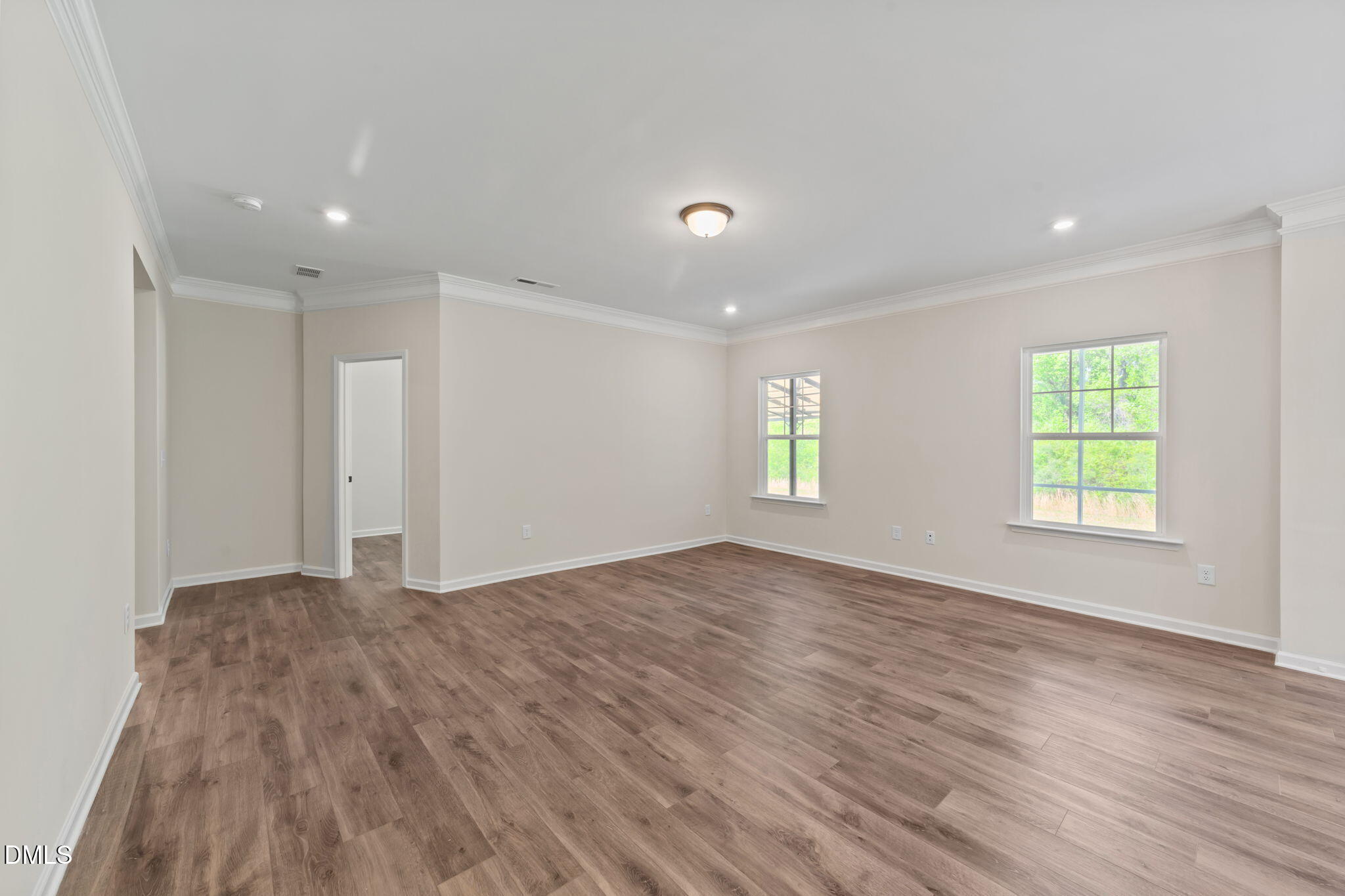 3901 Bluffwind Drive Raleigh, NC 27603 - Photo 11 of 42 wooden floor in an empty room with a window