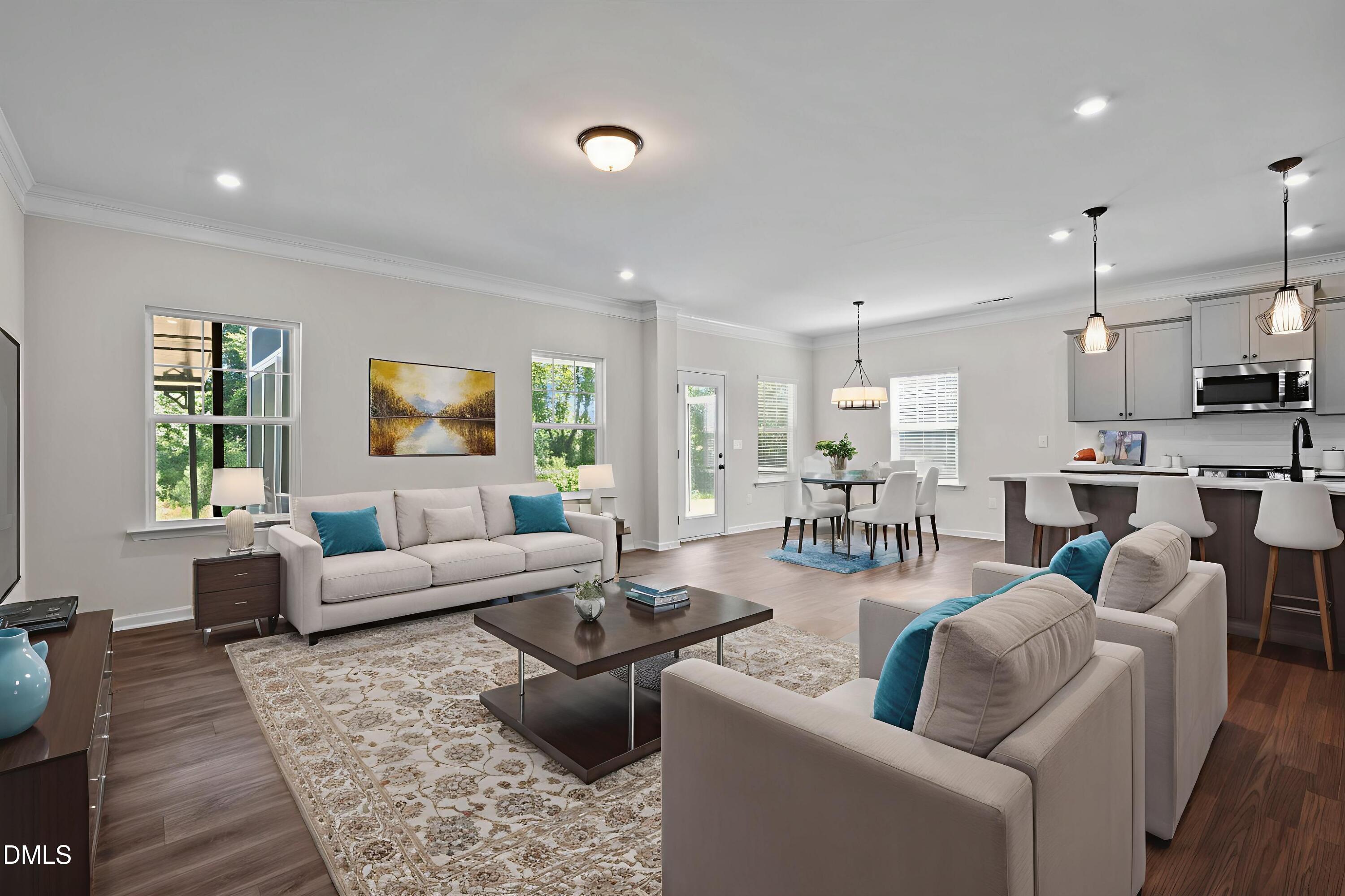 3901 Bluffwind Drive Raleigh, NC 27603 - Photo 12 of 42 a living room with furniture wooden floor and a large window