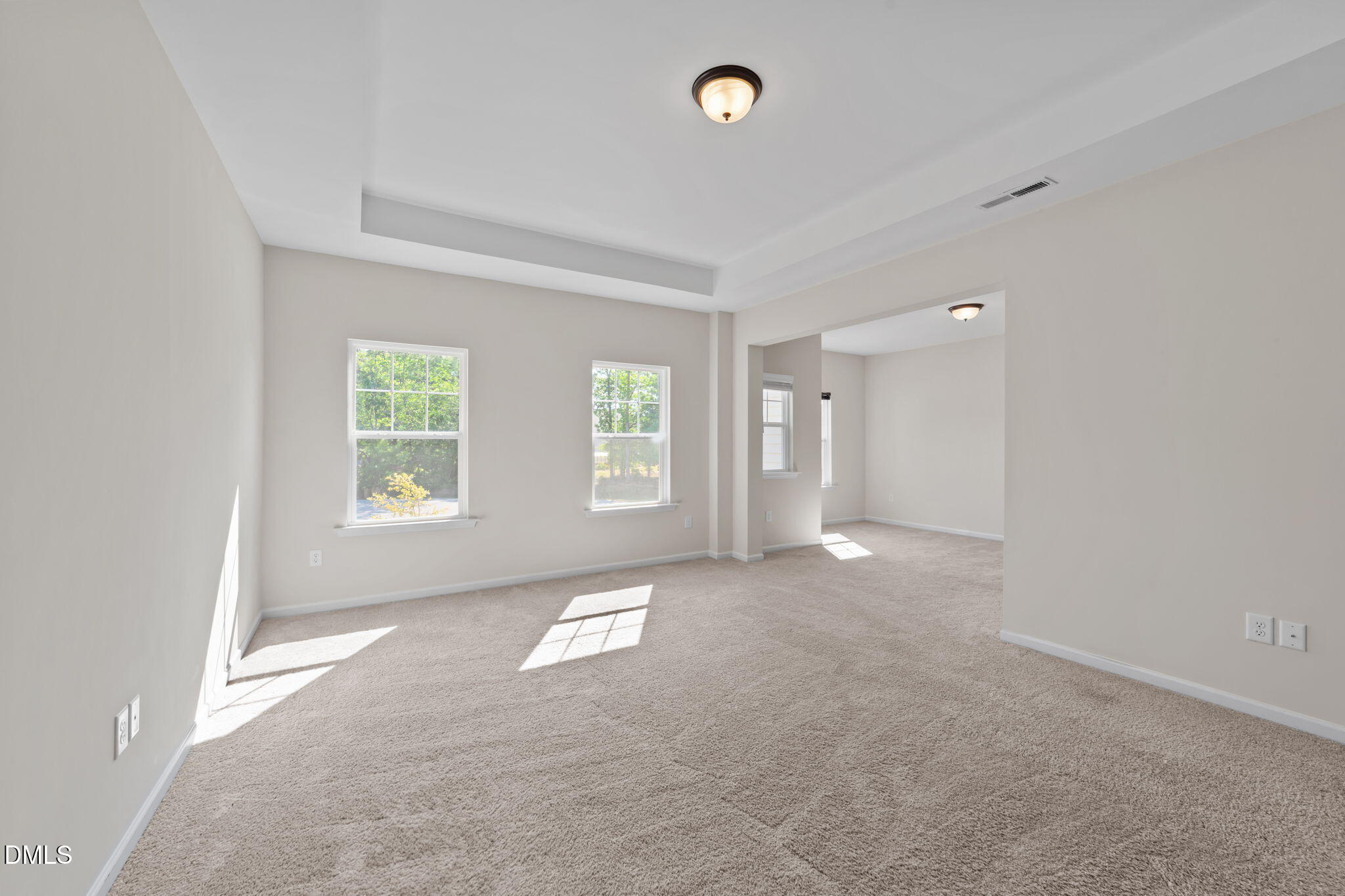 3901 Bluffwind Drive Raleigh, NC 27603 - Photo 16 of 42 an empty room with windows and closet