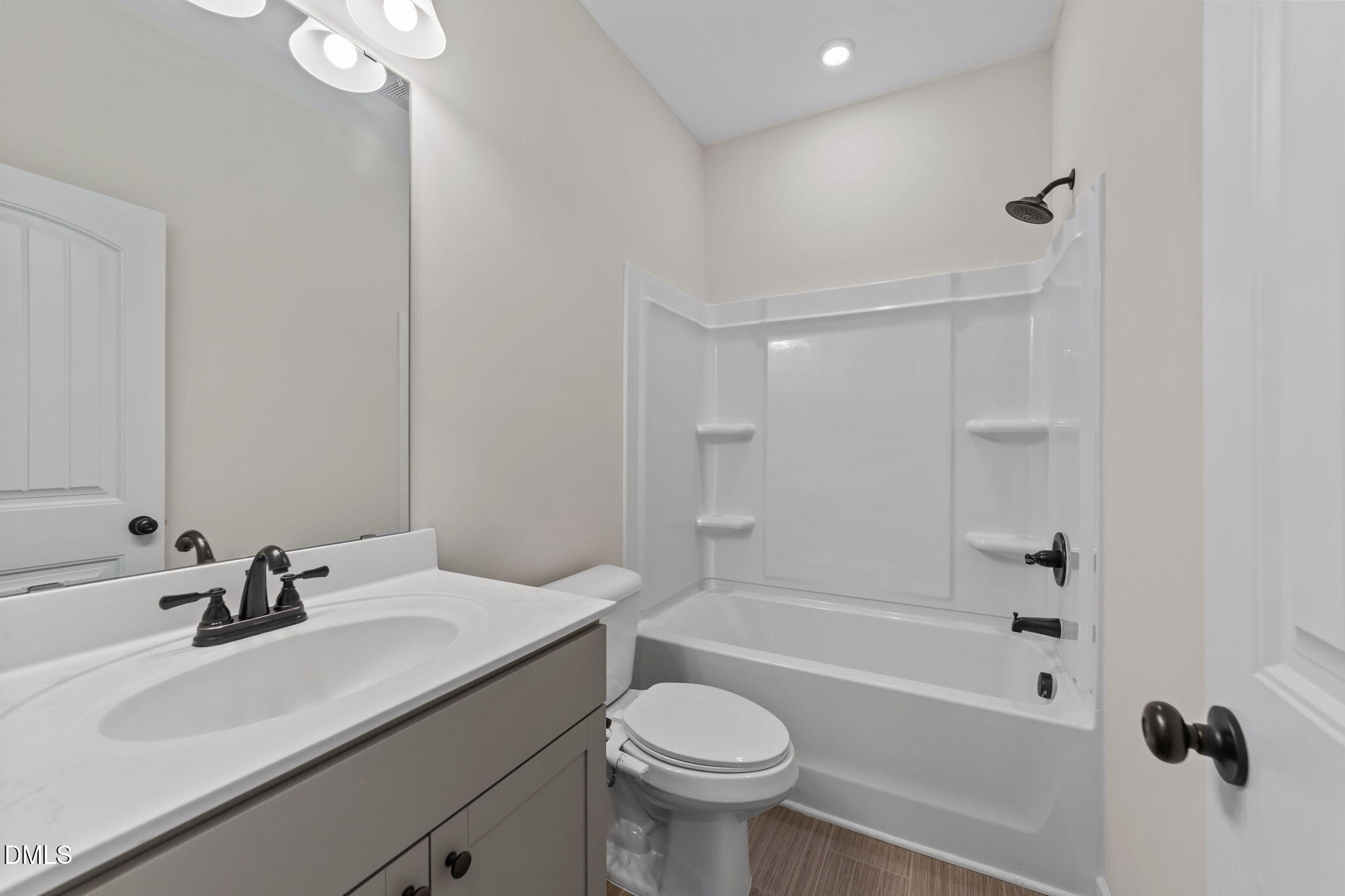 3901 Bluffwind Drive Raleigh, NC 27603 - Photo 26 of 42 a bathroom with a sink toilet tub and shower