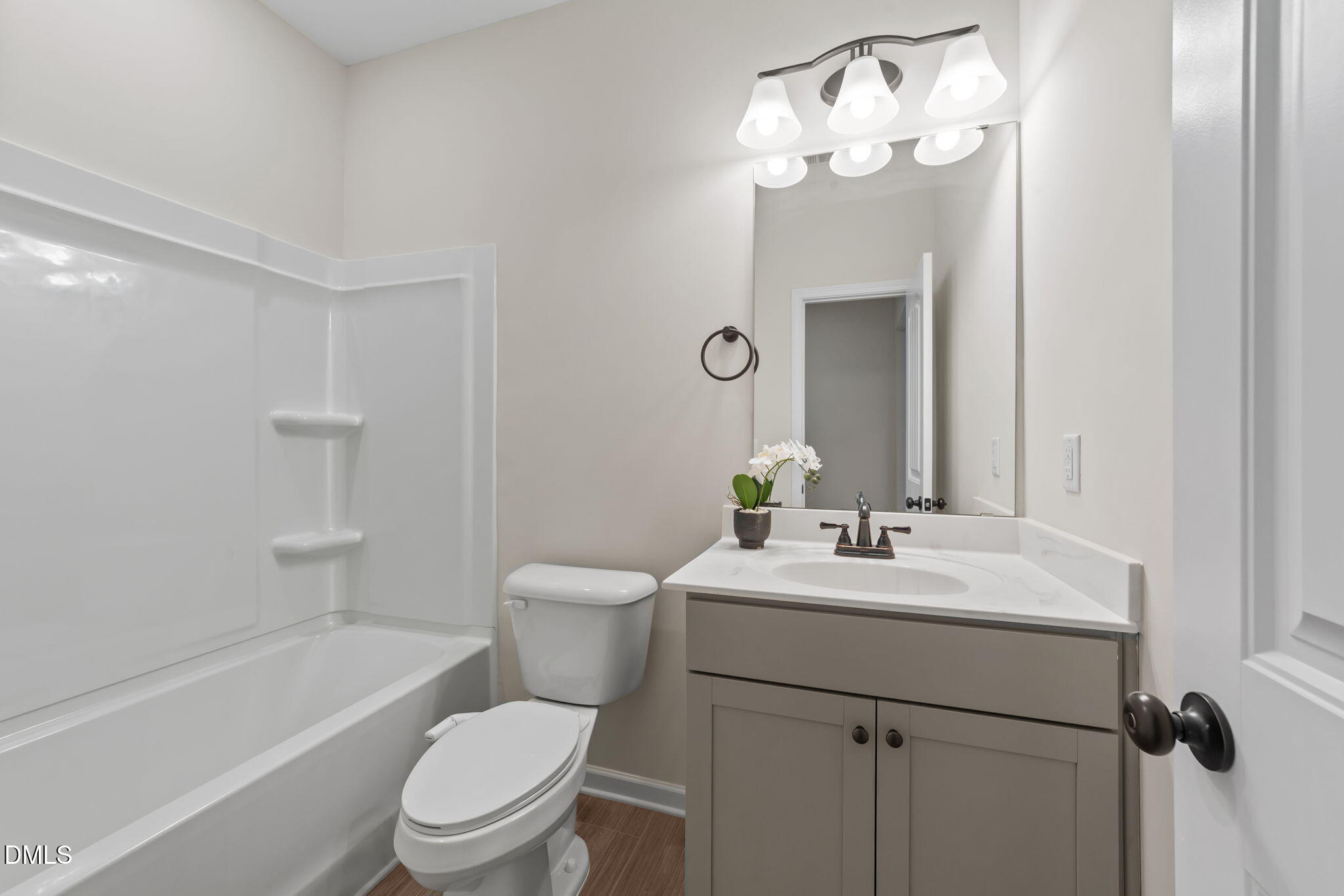 3901 Bluffwind Drive Raleigh, NC 27603 - Photo 30 of 42 a bathroom with a sink a toilet and shower