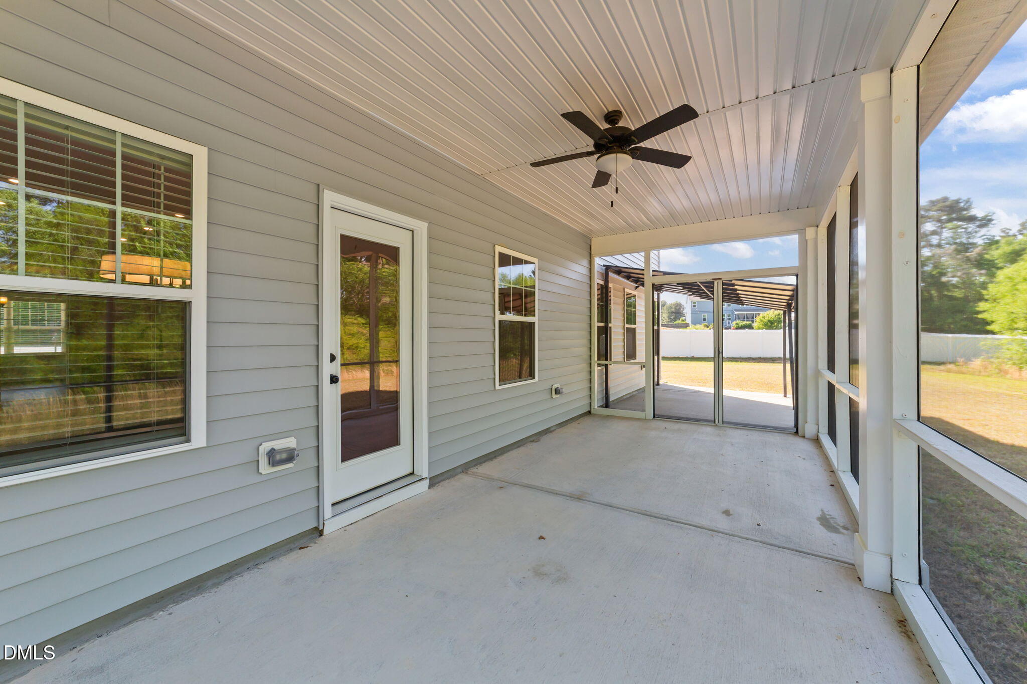 3901 Bluffwind Drive Raleigh, NC 27603 - Photo 34 of 42 a view of a porch with a ceiling fan and a window