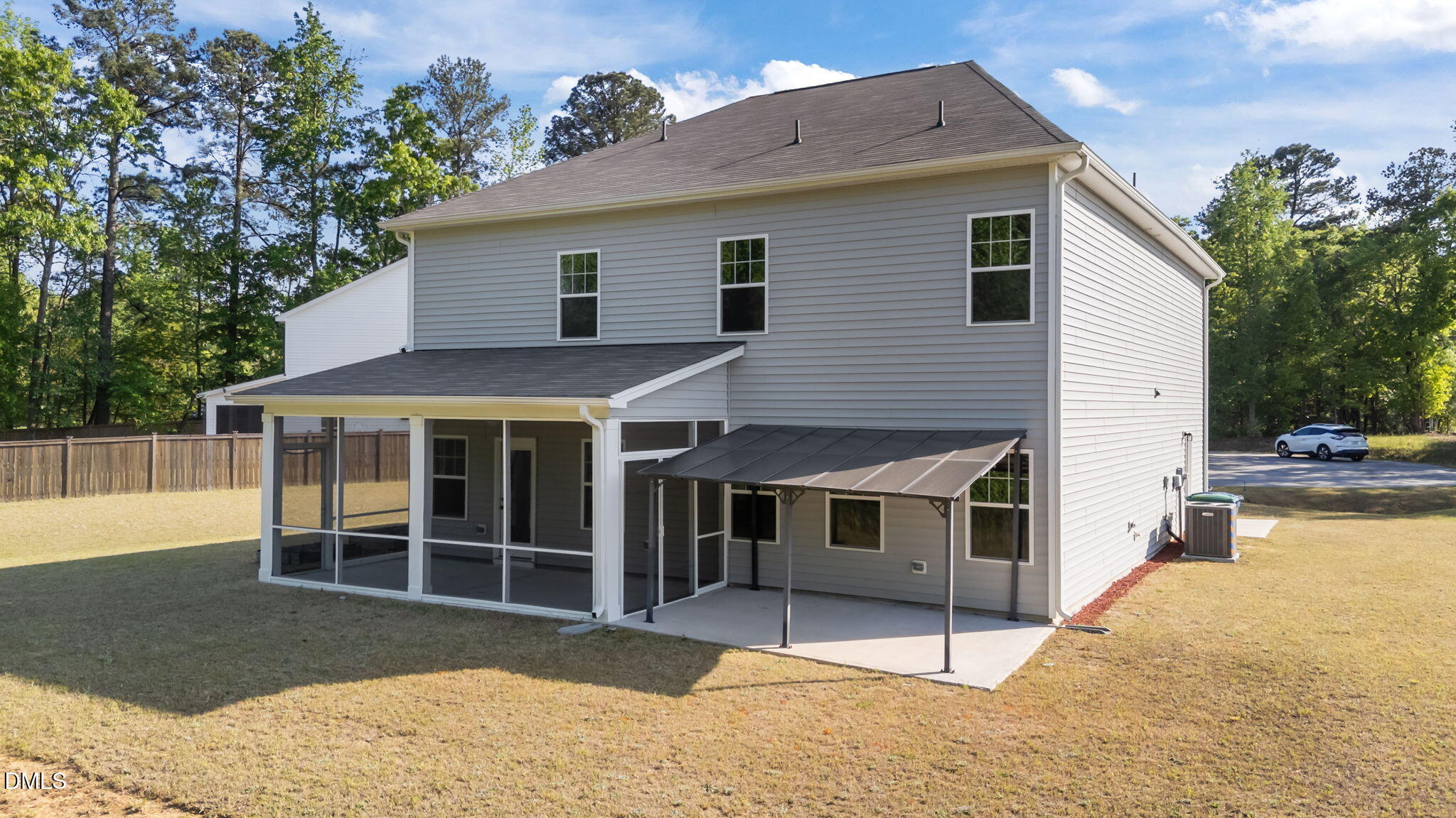 3901 Bluffwind Drive Raleigh, NC 27603 - Photo 35 of 42 a view of a house with a backyard and a window