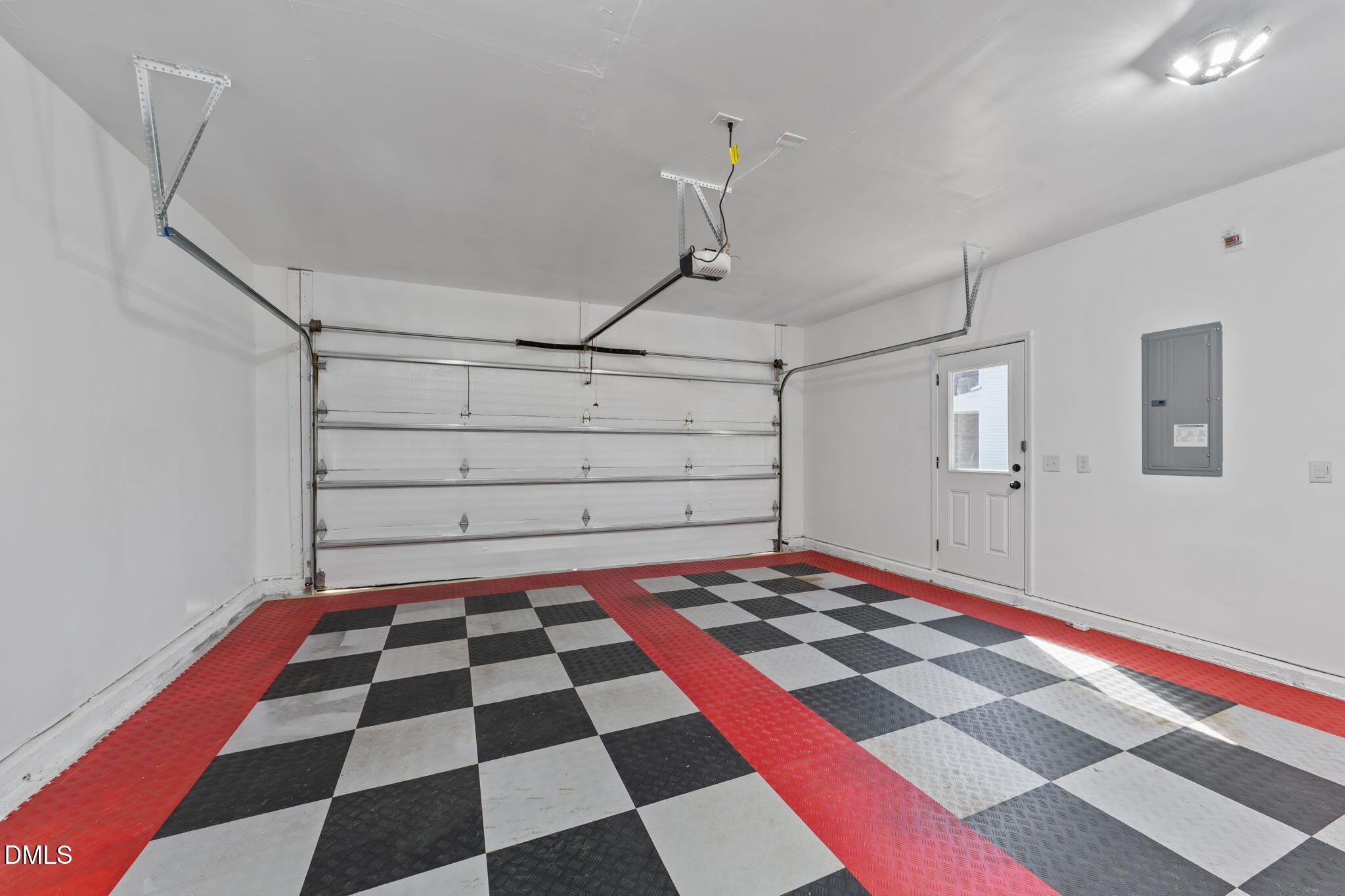 3901 Bluffwind Drive Raleigh, NC 27603 - Photo 37 of 42 a black and white checkered floor with a rug