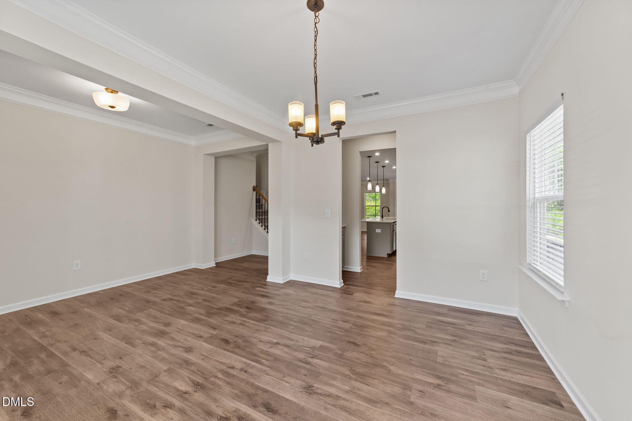 3901 Bluffwind Drive Raleigh, NC 27603 - Photo 5 of 42 a view of a room with window and hardwood floor