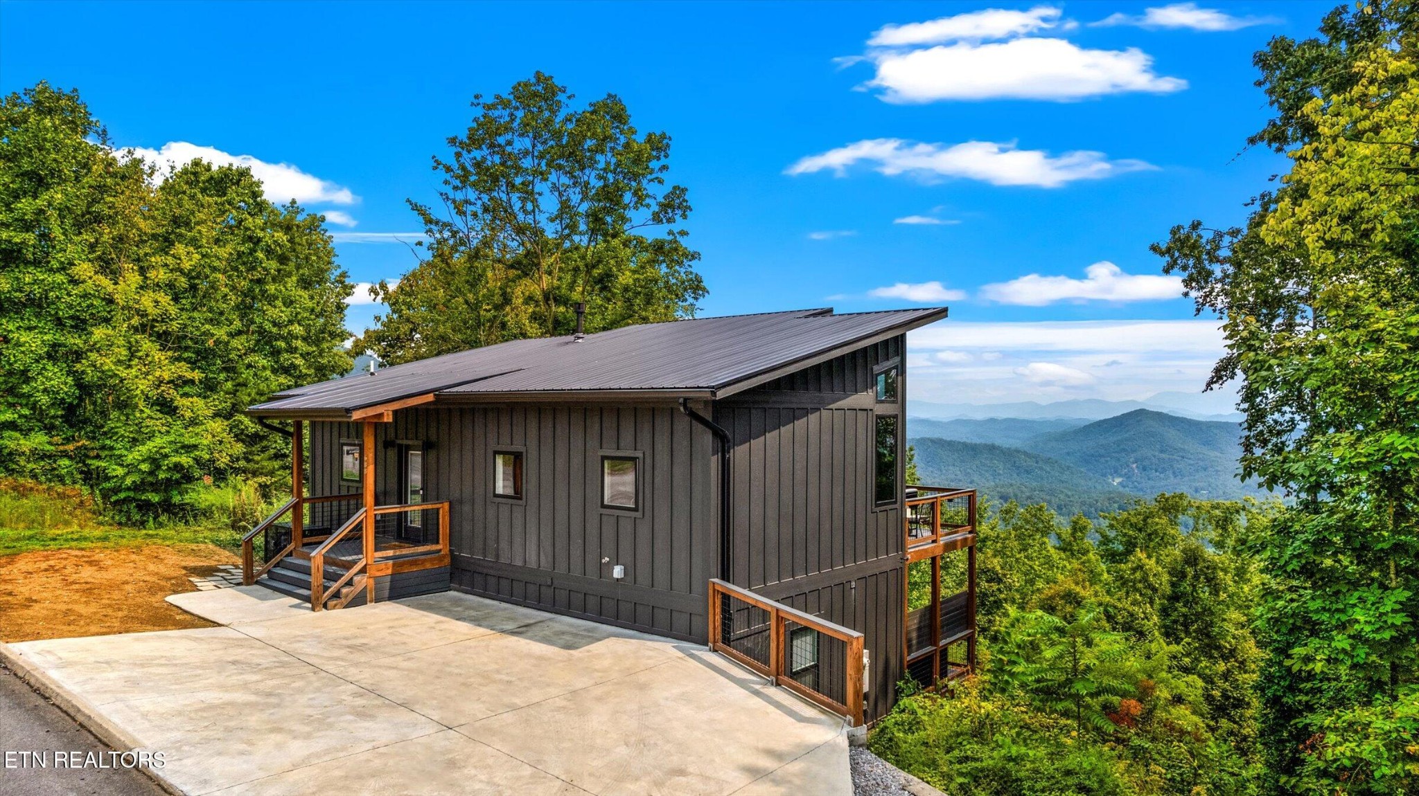 688 Shell Mountain Road Sevierville, TN 37876 - Photo 1 of 43 a view of a house with wooden fence