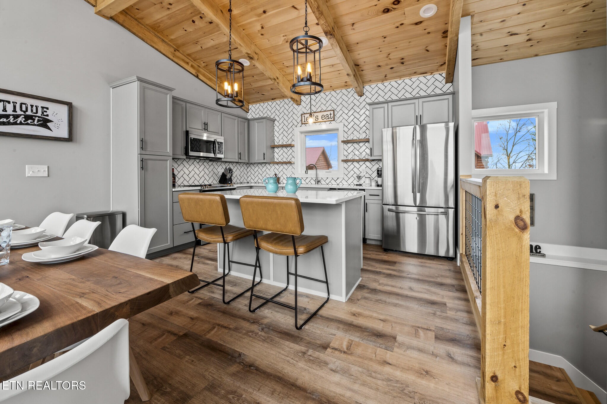 688 Shell Mountain Road Sevierville, TN 37876 - Photo 11 of 43 a view of a kitchen with dining table and chairs